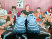 Front view of the pair showing the laces, padded tongues, patterned toe boxes and dark textured outsoles.