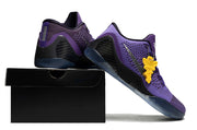 Purple shoes displayed on a black shoebox.