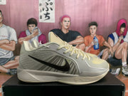 Side view showing the black Swoosh and textured gray panels on a Nike Kobe shoe