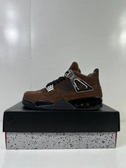 Clean side view of the brown and black sneaker with black laces and contrasting eyelet hardware.