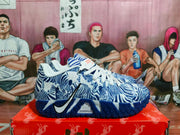 Side profile showing the Nike Swoosh, patterned upper, navy outsole, and visible Zoom branding.