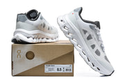 White and grey sneakers displayed with a Cloudtilt Remix box labeled size US 8.5, EU 42, UK 8, and 26.5 cm.
