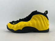 Black and bright yellow high-top sneaker with a molded yellow side panel.