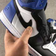 Detailed close-up of the white textured side panel, black Swoosh, blue ankle panel, and visible stitching.