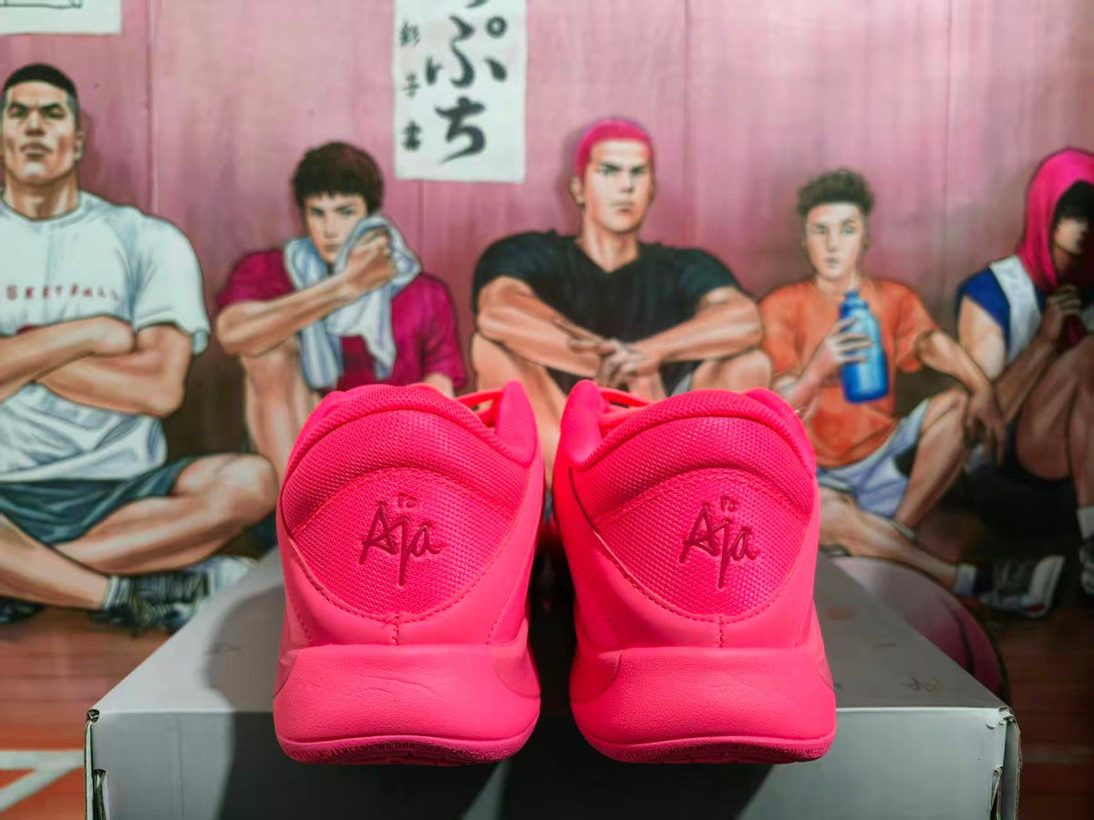 Rear view of bright pink Nike basketball shoes showing the padded heels and A'ja markings.
