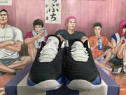 Front view of black and blue Jordan Luka basketball shoes with white laces