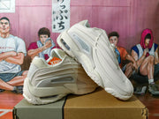Angled side view of off-white sneakers showing layered panels, translucent side inserts and sculpted outsoles.