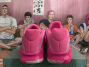 Rear view of the pink Nike basketball shoes with padded heel panels and visible Cushion 3.0 branding.