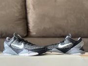 Side-by-side profile view showing the low-cut shape, striped panels and grey geometric midsoles.