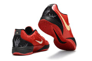 Red and black Nike Ja 2 shoes shown from rear and outsole angles