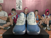 Front view showing the white laces, blue toe panels, and Jumpman tongue logos.