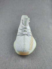 Front view showing the knit-patterned uppers, laces, side stripe, and translucent toe area.