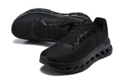 Pair of black On running shoes shown from above and at an angled front view.