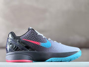 Opposite side view showing the textured upper, colored Swoosh, and glossy black heel.