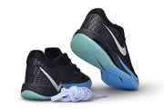 Black and blue Nike Sabrina 4 shoes shown from the heel and outsole