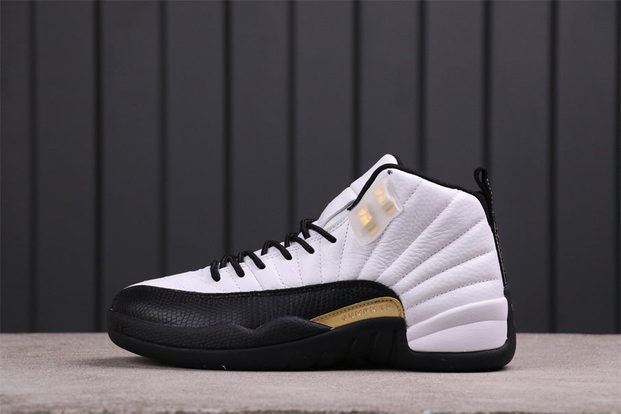 Side view of a white, black, and gold Air Jordan 12 high-top sneaker