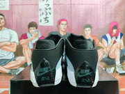 Rear view of black and blue-grey Jordan Luka 1 basketball shoes