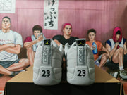 Rear view of wolf grey Jordan sneakers with Jordan heel tabs and 23 details.