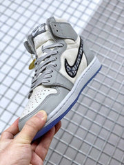 Angled side view showing the high-top construction, patterned Swoosh, and gray overlays.