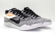 Pair of black-and-white low-top sneakers in a front three-quarter view