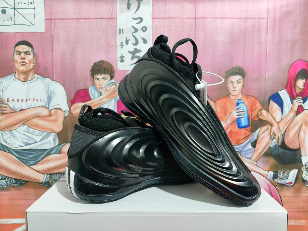 Black Nike sneakers shown from the side and sole, with a sculpted wave-like design.