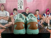 Rear view showing padded collars, brown-gold heel panels and molded mint green soles.