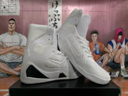 Three-quarter view showing the high-top construction, lace-up fronts, textured side panels, and black midsole accents.