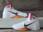 Two views of a white high-top basketball shoe with black Swoosh and gold-toned midsole panels.