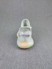 Rear view of a pale gray kids' sneaker with a padded collar and translucent-looking sole.
