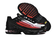Pair of black, white, and red Nike Air Max Plus III sneakers showing the outsole and side design.