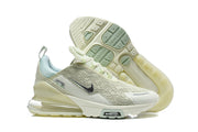 Side view of pale green Nike Air Max 270 Premium sneakers with the outsole visible.