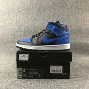Side view of the sneaker positioned on its box, with visible box labels and size markings.