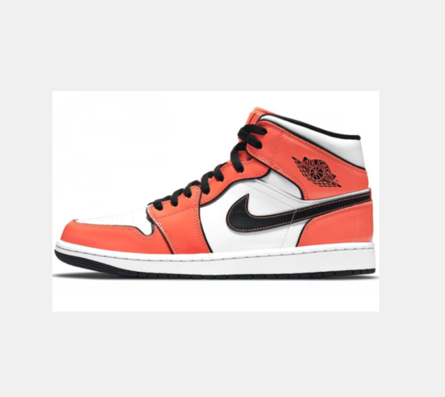 Side view of red, white, and black high-top sneakers with a contrasting Swoosh, winged basketball emblem, padded collar, and layered rubber sole.