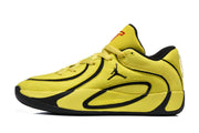 Side profile of one yellow and black sneaker showing the layered upper and black outsole.