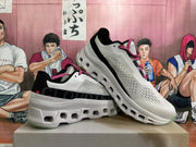 Two sneakers displayed together, showing their side profiles, pink laces and open-cavity soles.