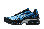 Side view of a blue patterned Nike Air Max Plus VII sneaker with black laces and visible sole cushioning.