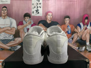 Rear view showing padded collars, heel detailing, and black contrast panels between the shoes.