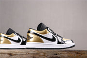 Side profile of the low-top sneaker showing metallic gold heel and collar accents, black overlays, white panels, and a white midsole.