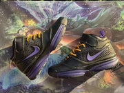 Pair of black and purple high-top sneakers displayed from opposing side angles.