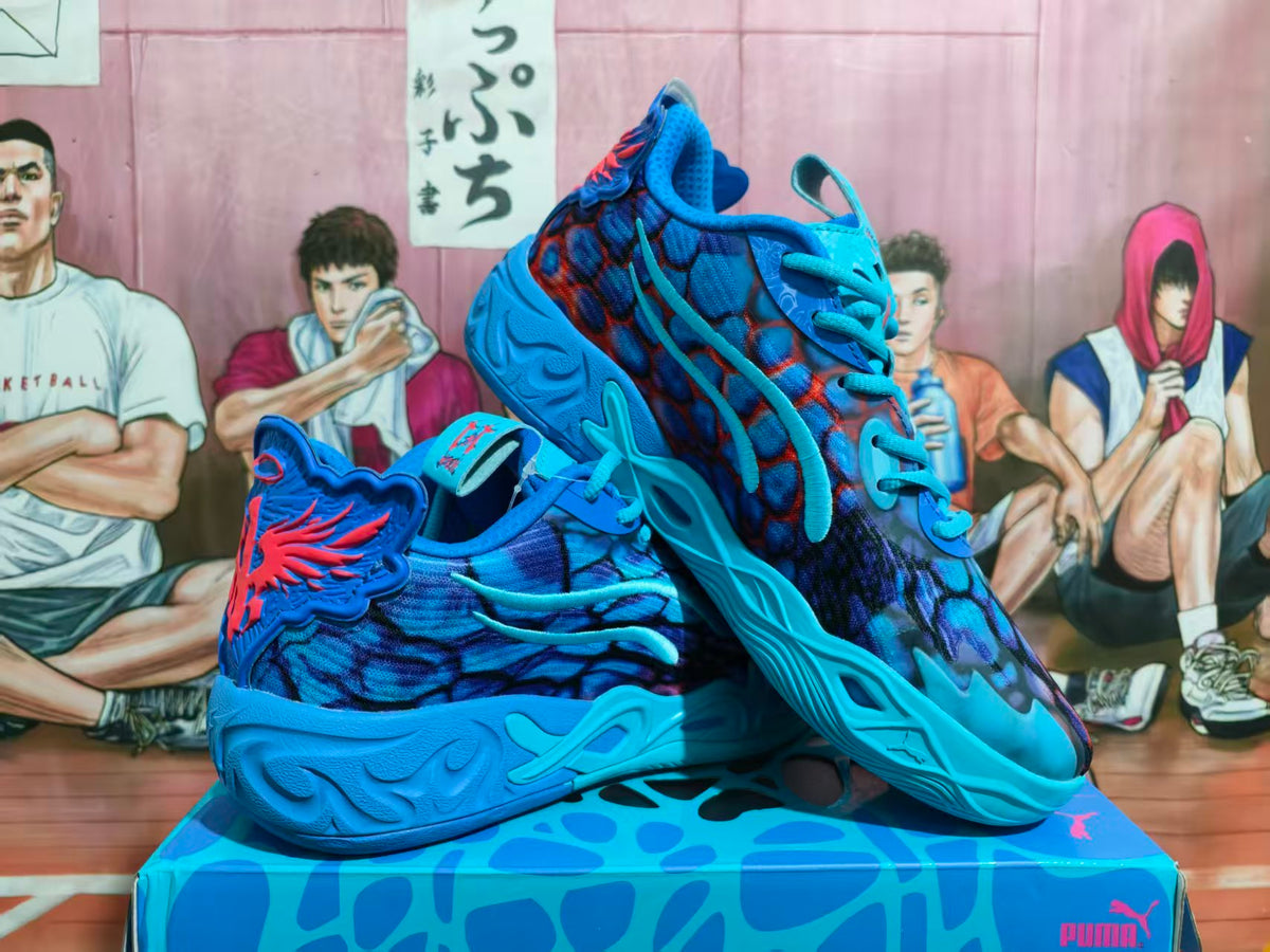 Pair of blue and red Puma basketball sneakers shown from the side on a matching box.