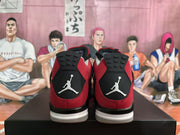 Rear view showing black heel panels with white Jumpman graphics on the red high-top sneakers.