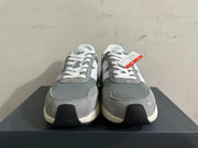 Front view of gray and white New Balance U370 sneakers with white laces.