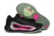 Side and outsole view showing black shoes with layered white and pink side detailing, patterned translucent tread, and visible Cushlon branding.