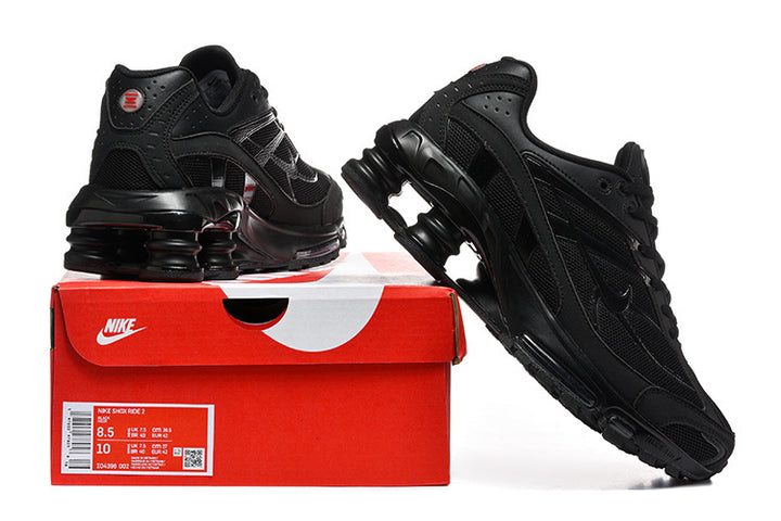 Black Nike Shox Ride 2 sneakers displayed with a red shoebox; the box label shows a sample size of US men's 8.5 and US women's 10.