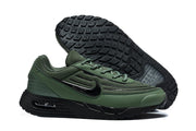 Green Nike Air Max VERSA sneaker beside a view of its black tread outsole.