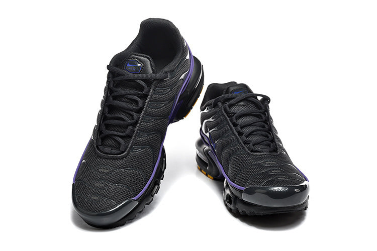 Pair of black Nike Air Max Plus sneakers with purple accents, shown from front and top angles