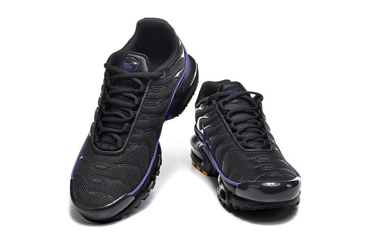 Pair of black Nike Air Max Plus sneakers with purple accents, shown from front and top angles