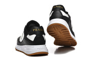 Rear and outsole views of black and white low-top sneakers