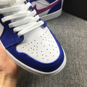 Close-up of the white perforated toe box and blue toe overlay