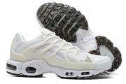 Side and outsole views of white Nike Air Max Terrascape Plus sneakers with multicolor outsole details.
